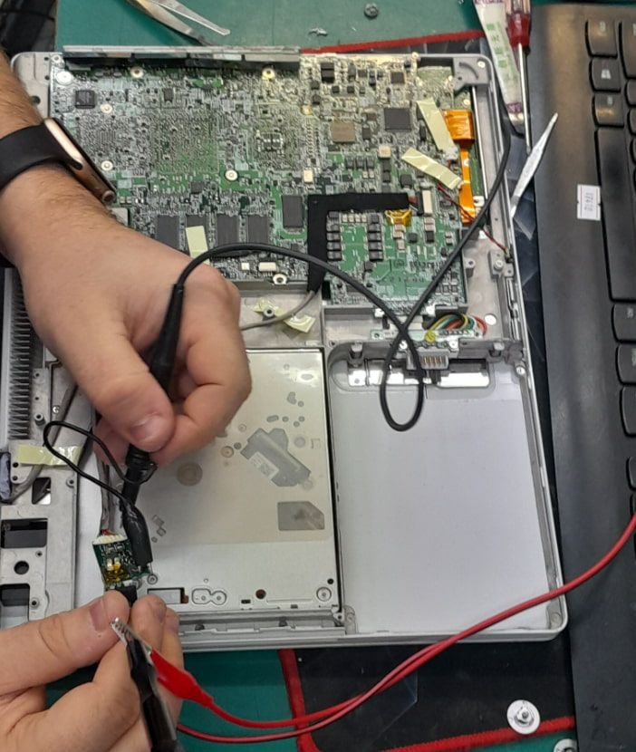 A Person Is Working On A Laptop — Dateline Computers Authorised Jaycar Reseller In Cannonvale, QLD