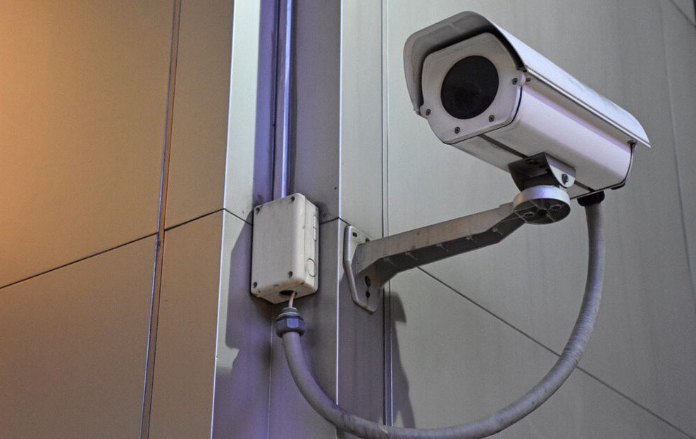 A Security Camera Is Mounted On The Side Of A Building — Dateline Computers Authorised Jaycar Reseller In Cannonvale, QLD