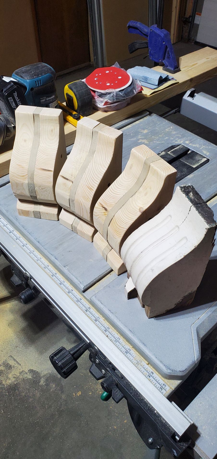 A wooden block is sitting on top of a table saw.