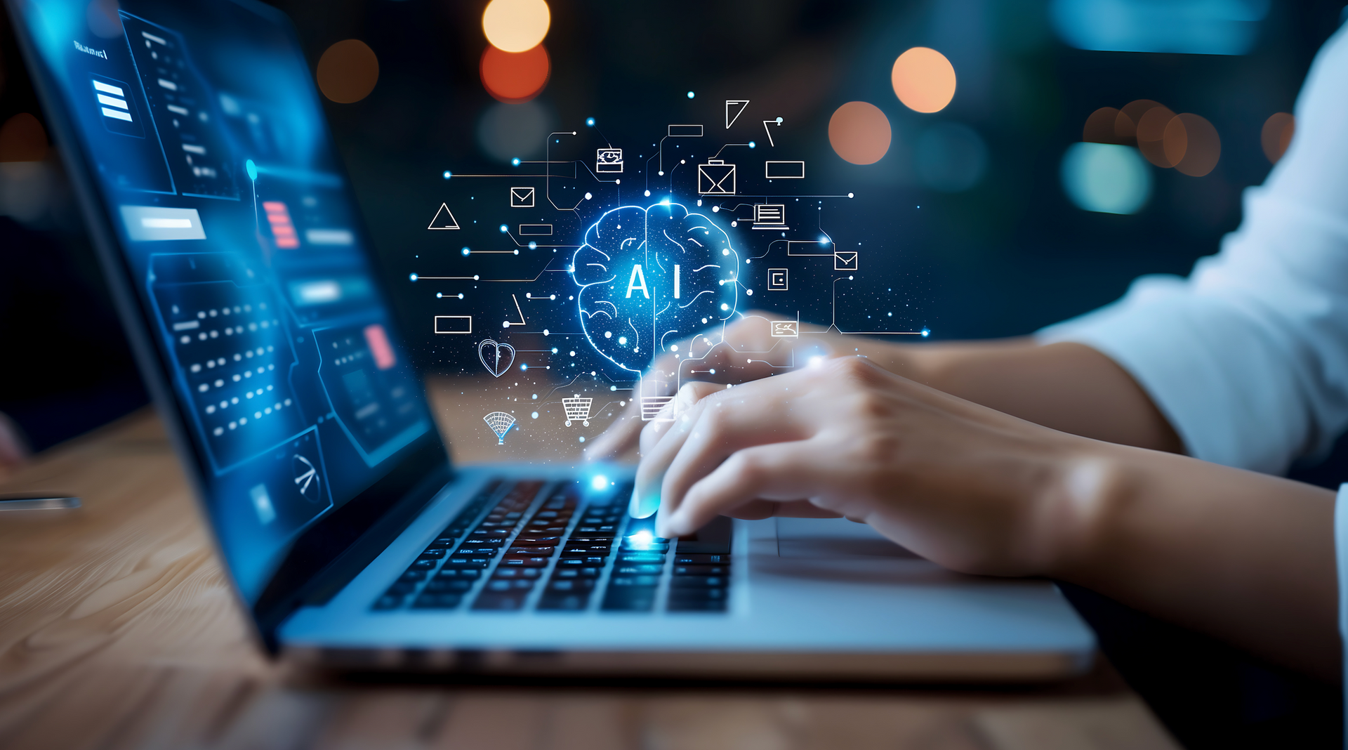 A person is typing on a laptop computer.