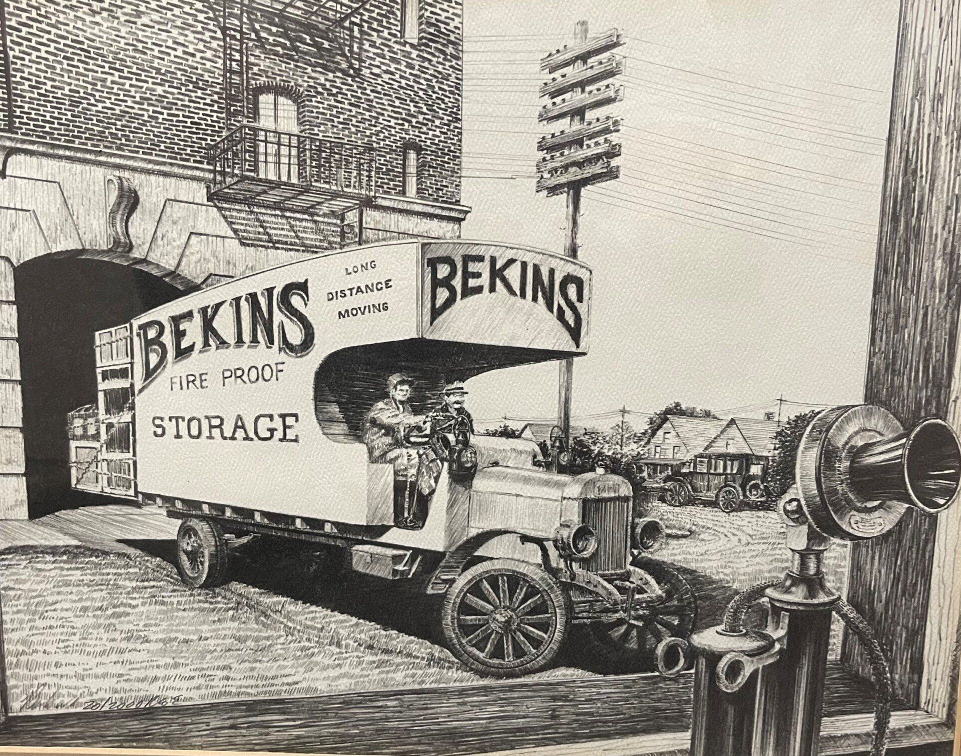 Bekins storage truck exiting an arched doorway. Two people inside.