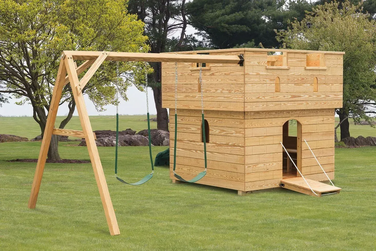 Handcrafted wooden castle playground featuring towers, slides, and climbing activities