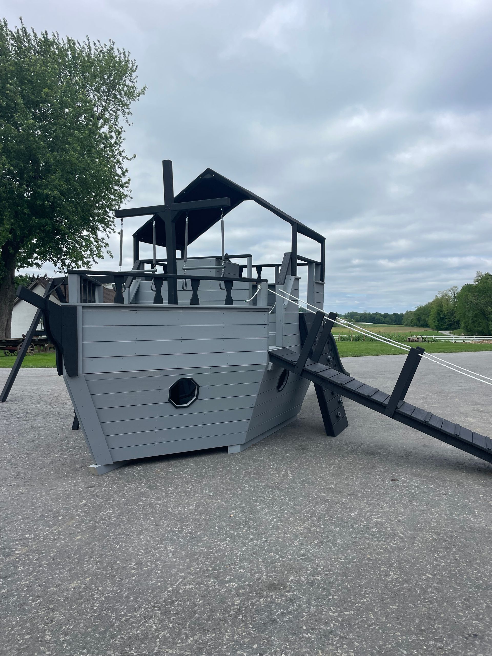 Amish-built custom playground with slide and swings