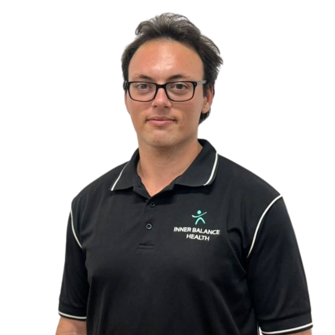 Man in black polo shirt with white trim against a white background — Inner Balance Health in Coconut Grove, NT