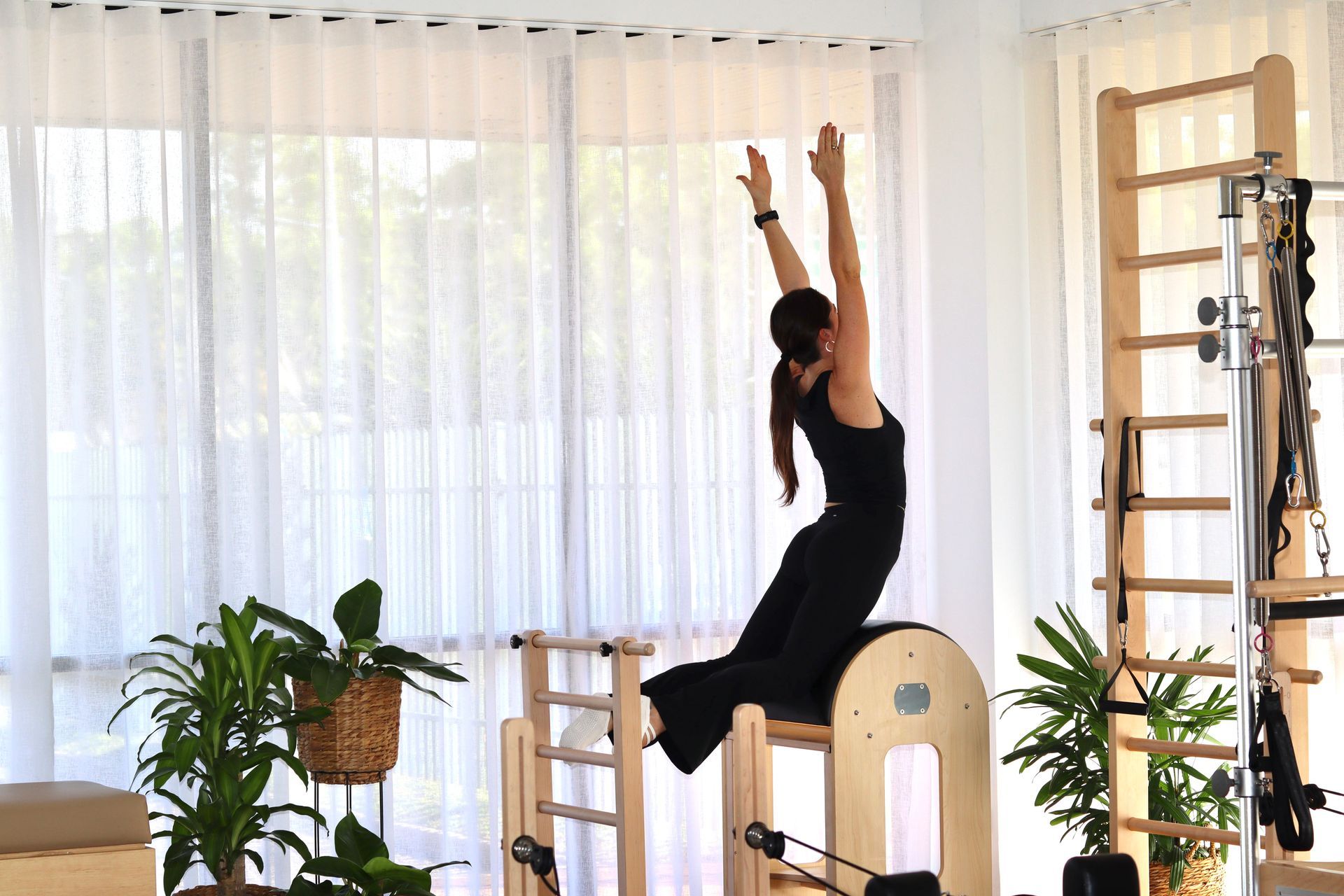 A Person in Black Workout Clothes Exercises — Inner Balance Health in Coconut Grove, NT