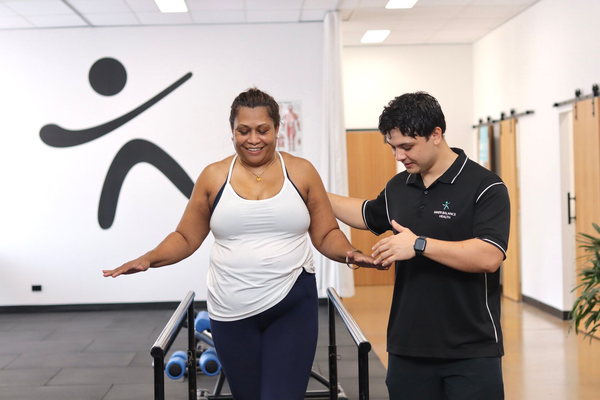 A Physical Therapist Assists an Individual With Balancing Exercises — Inner Balance Health in Coconut Grove, NT
