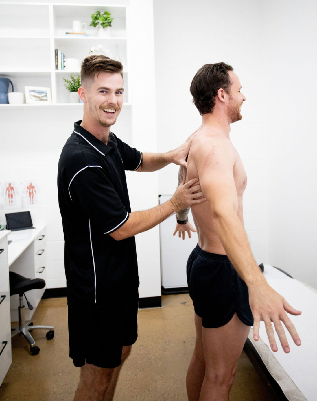 physiotherapist checking a mans back — Inner Balance Health in Coconut Grove, NT