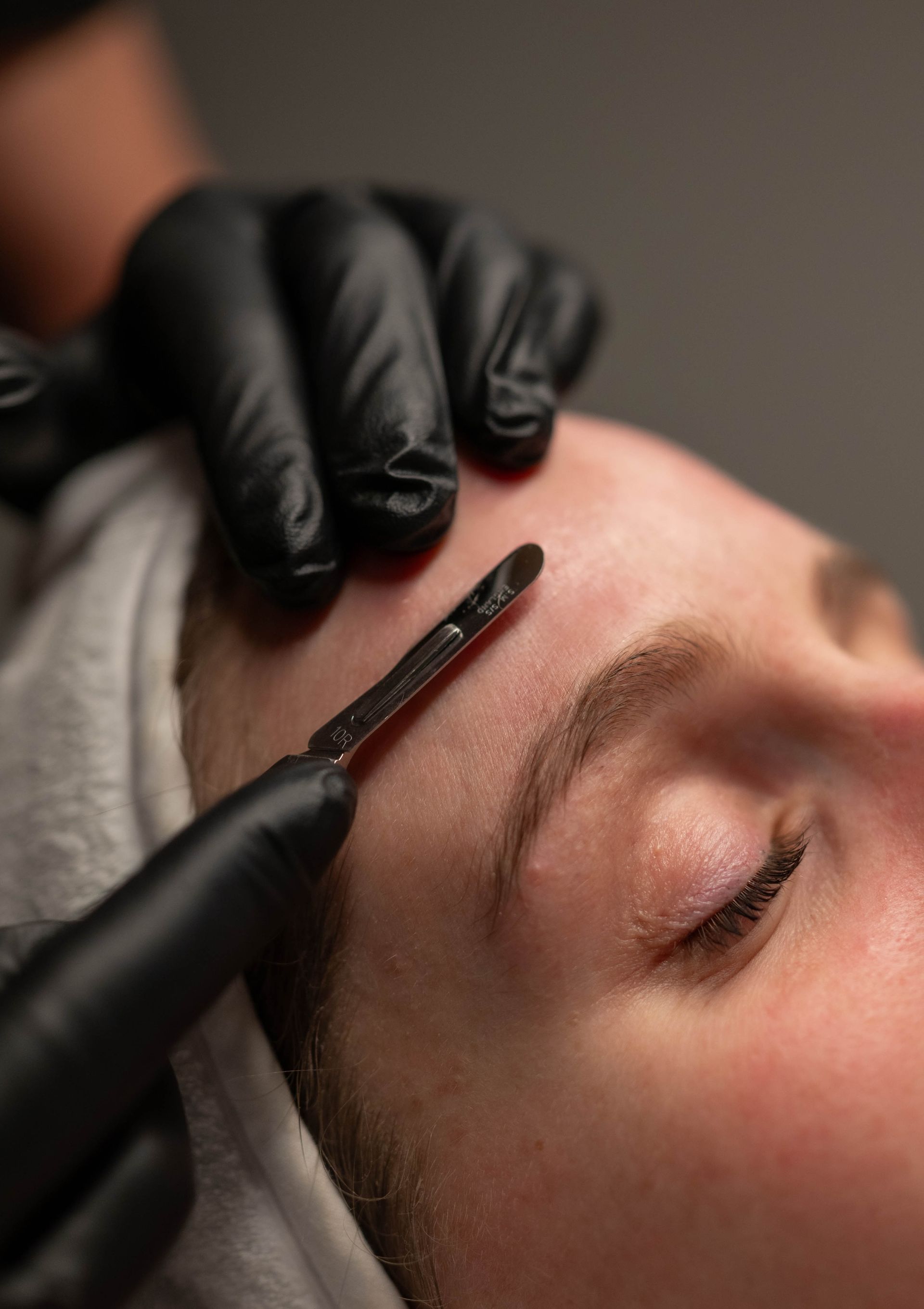 a woman is getting a facial treatment at a spa .