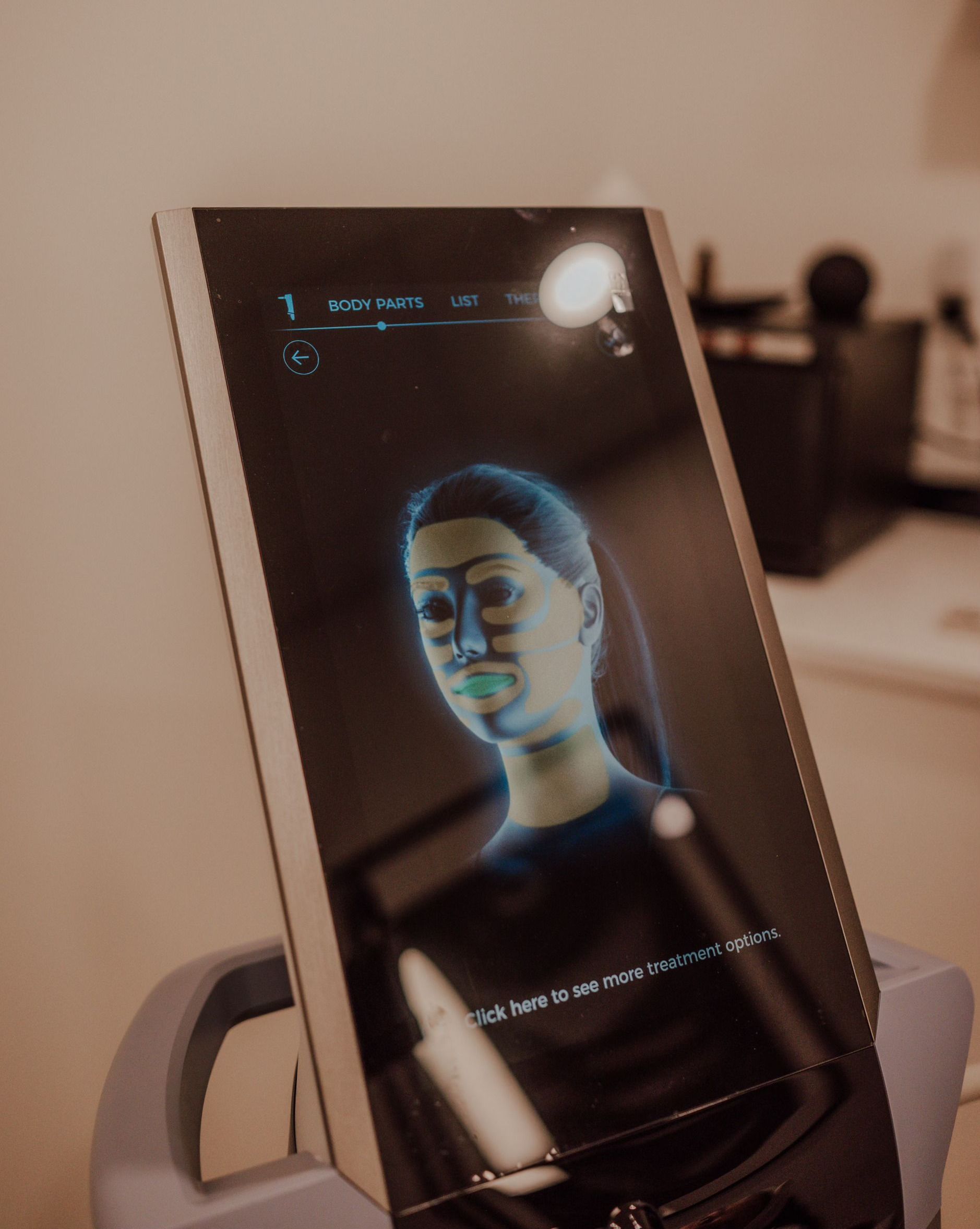 A computer monitor with a picture of a woman 's face on it.