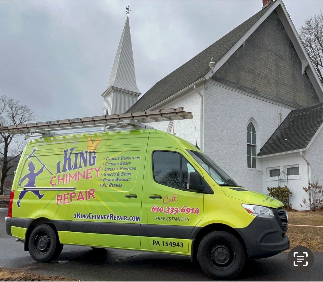 A bright lime-green King Chimney Repair van parked in front of a white church with a steeple on a cloudy day.
