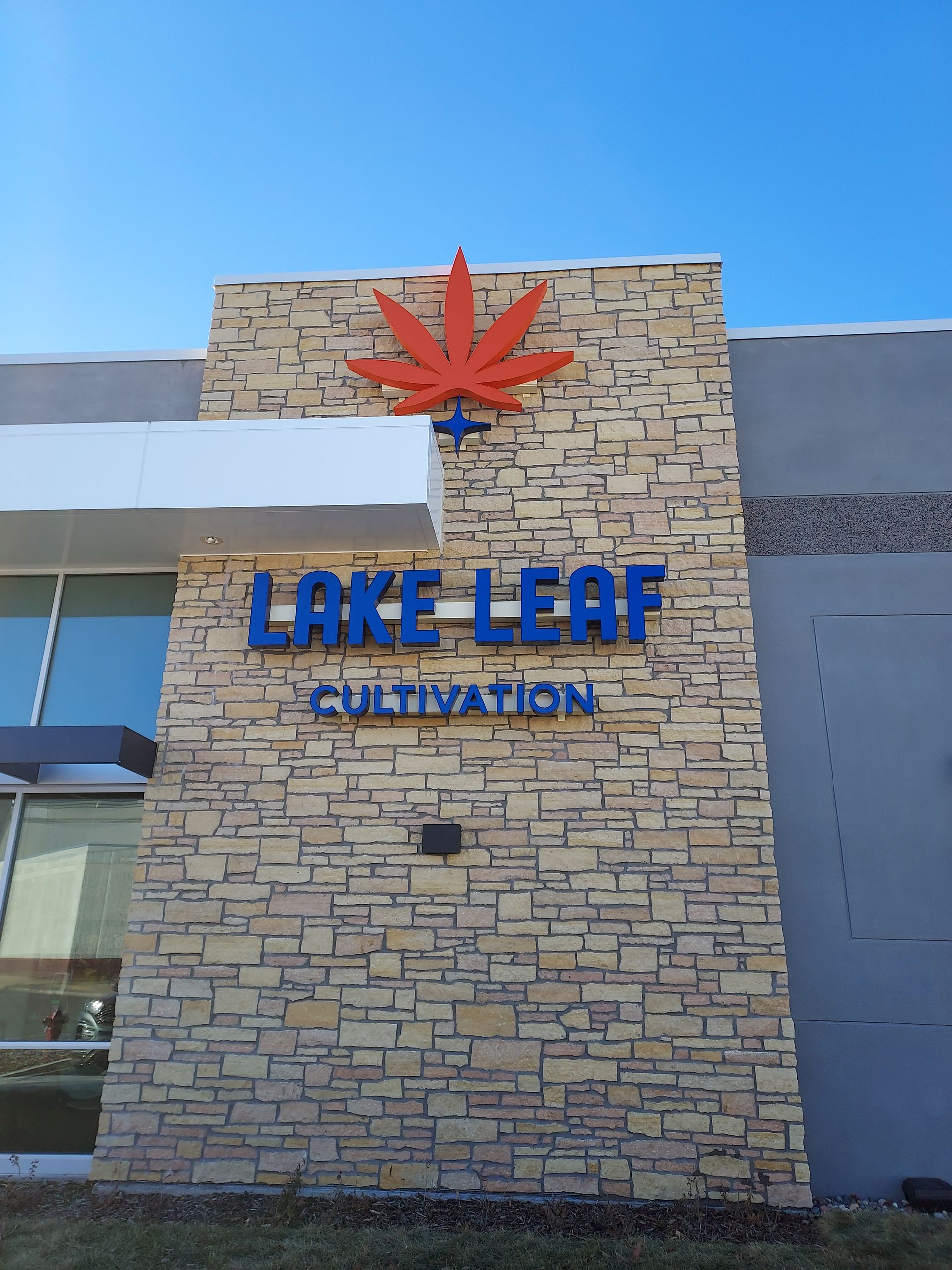 A brick building with a sign that says lake leaf cultivation