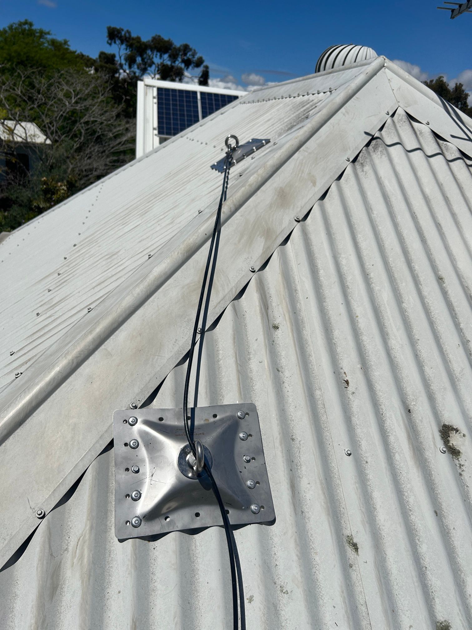 A roof with a solar panel on top of it