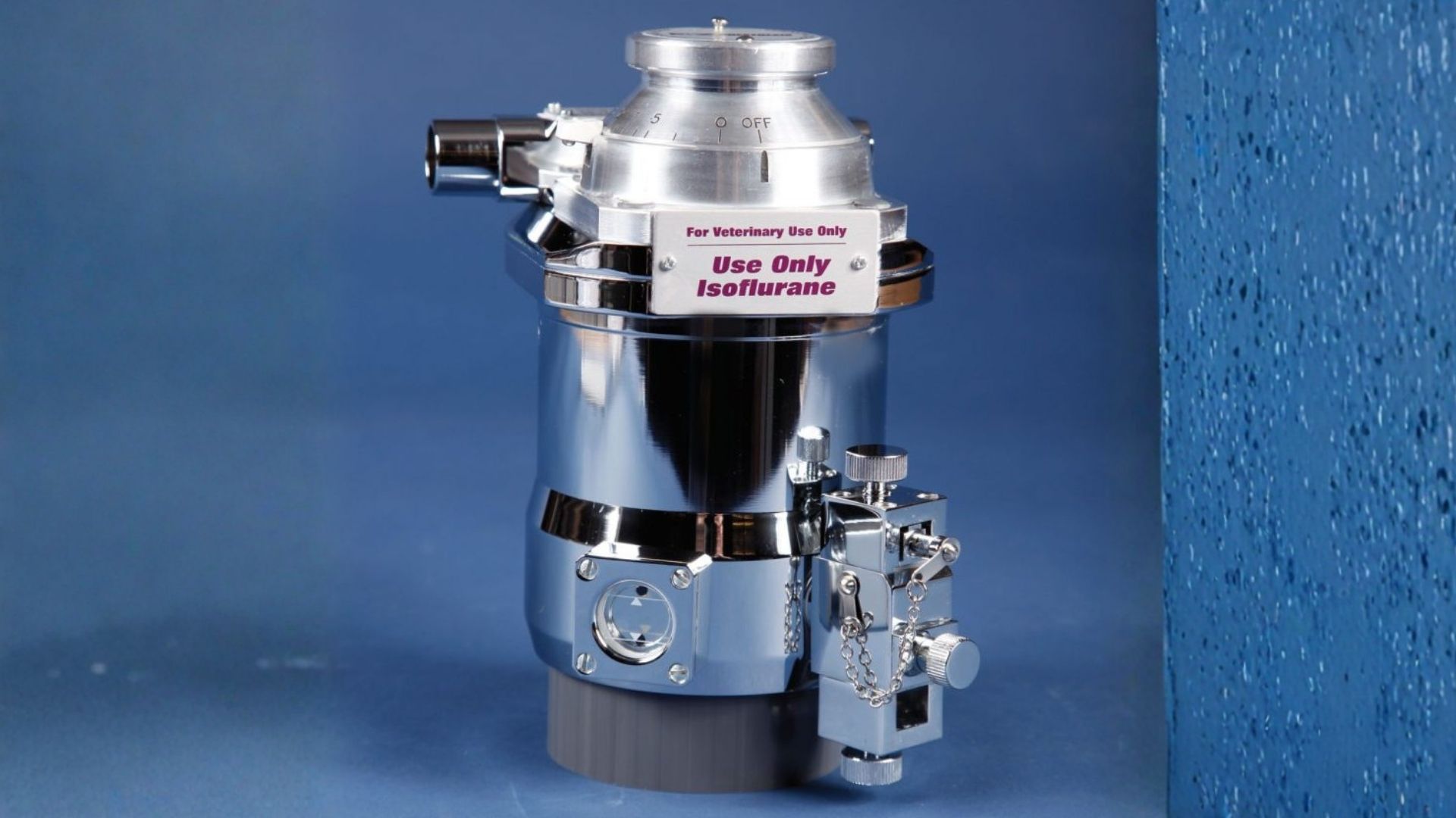 Silver countertop beverage dispenser with three black faucets, center unit, and right-side water gauge.