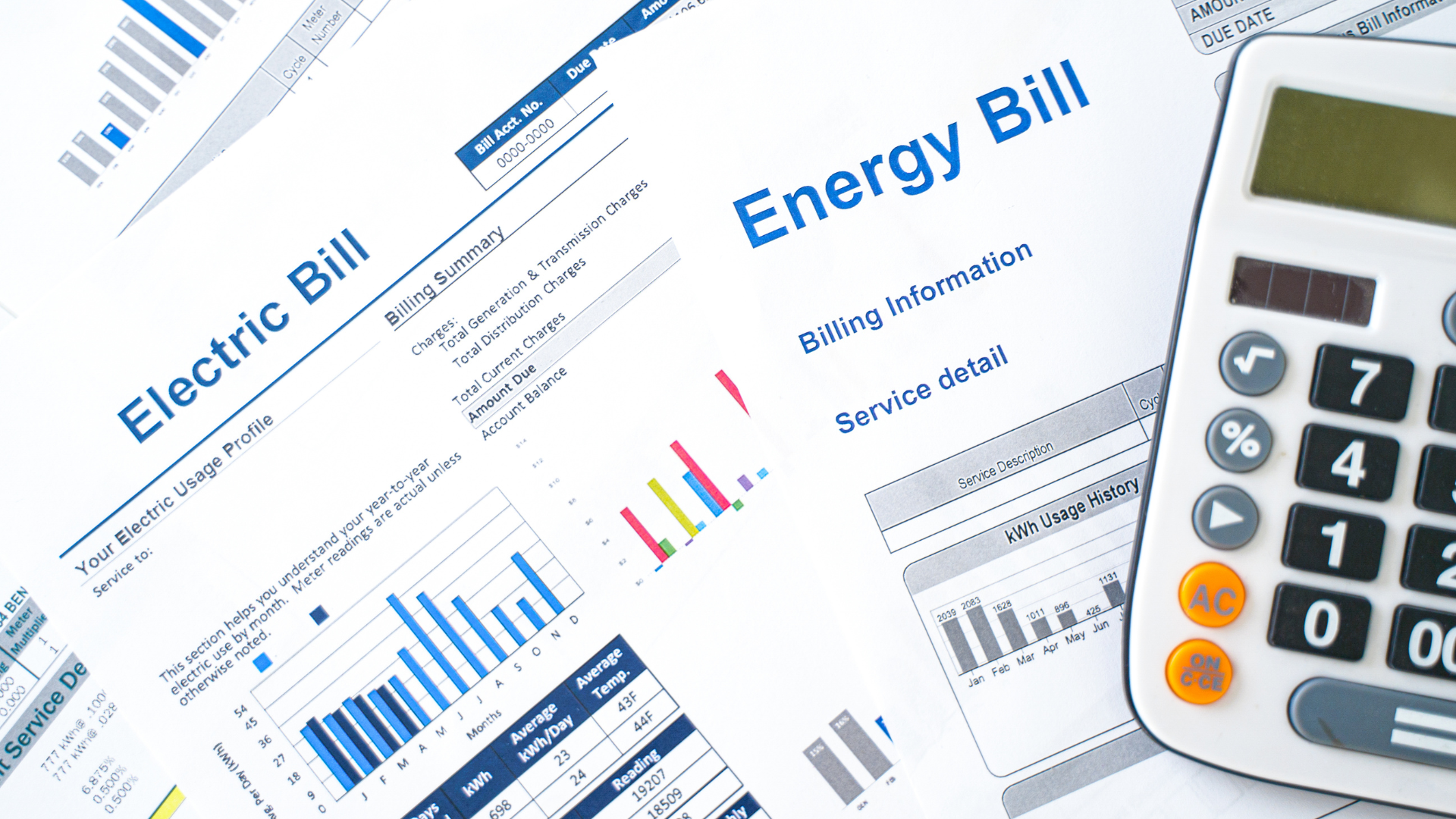 A calculator is sitting on top of an electric bill.