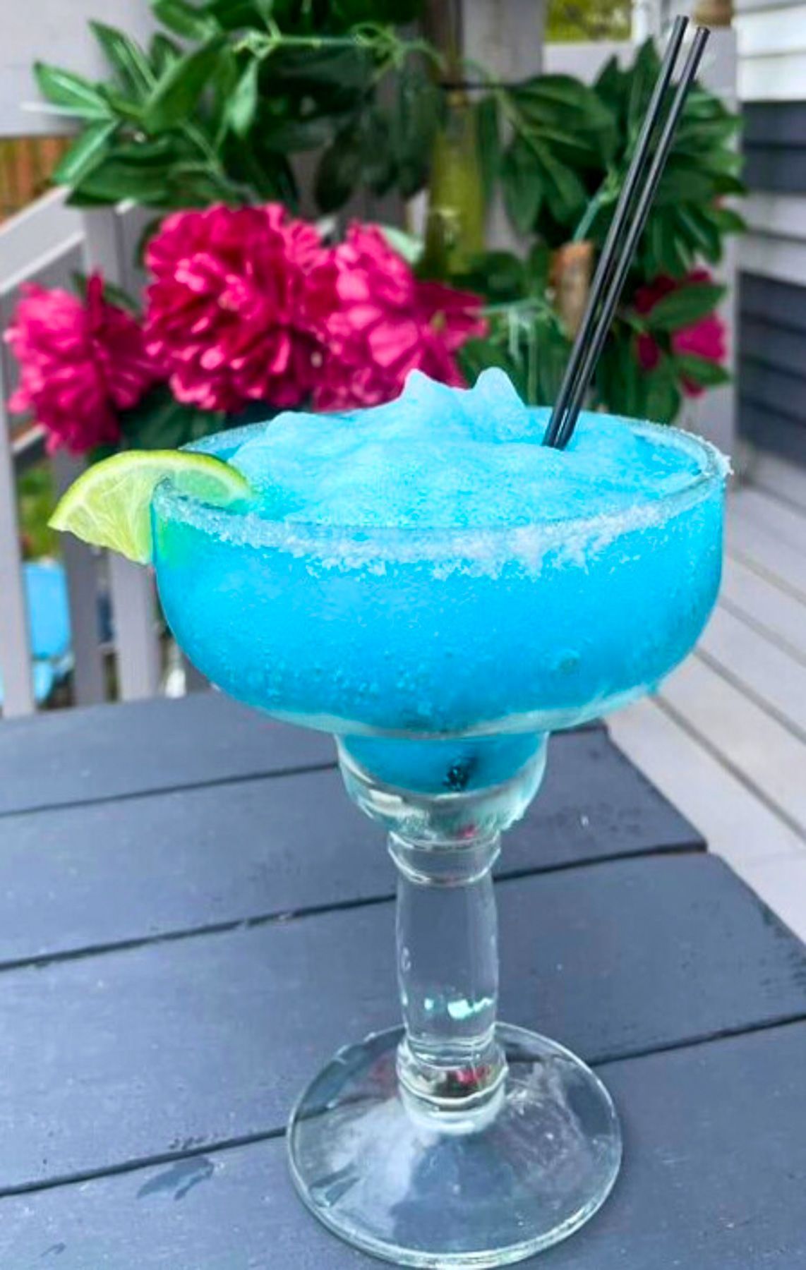 Blue frozen margarita with a salted rim and lime at El Sureño