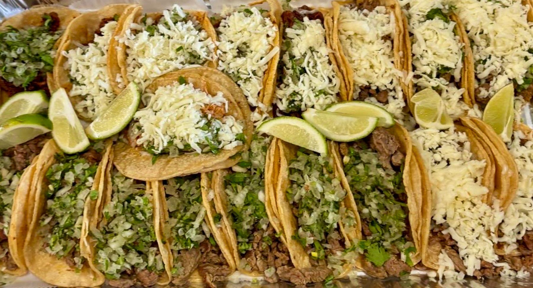 Large catering platter of tacos for a group order from El Sureño