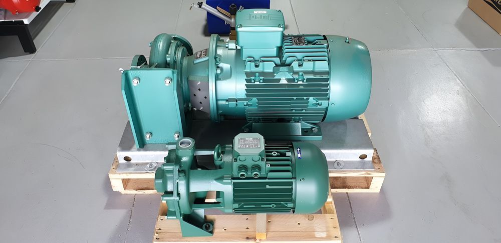 Two Green Pump  Are Sitting On A Wooden Pallet — Manning Valley Pumps And Irrigation In Wingham, NSW