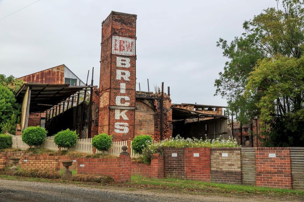 A Large Brick Building With The Word Bricks On It — Manning Valley Pumps And Irrigation In Wingham, NSW