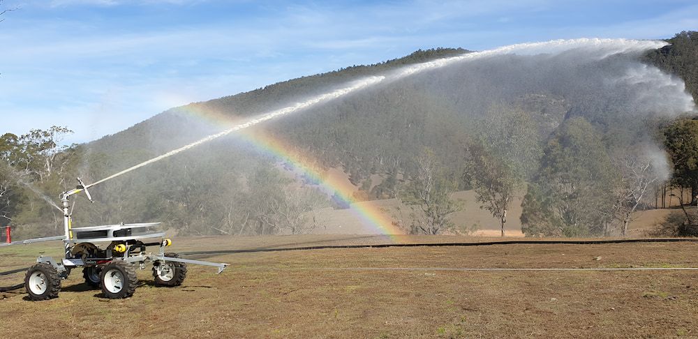 A Sprinkler Is Spraying Water In A Field — Manning Valley Pumps And Irrigation In Wingham, NSW