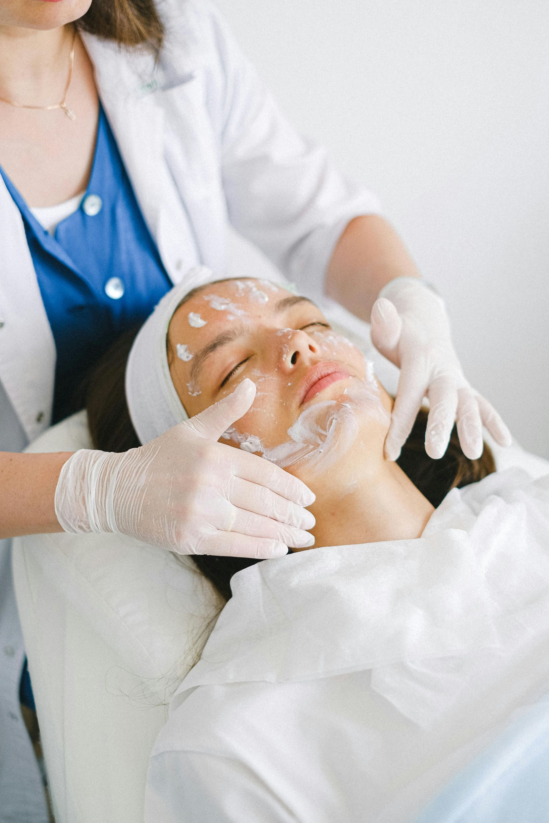 A Woman is Getting a Facial Treatment at a Beauty Salon — Aria Skin & Beauty in Gympie, QLD