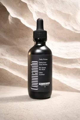 Black dropper bottle labeled “COORDINATE” on a beige textured background