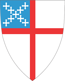 A shield with a red , white and blue cross on it.