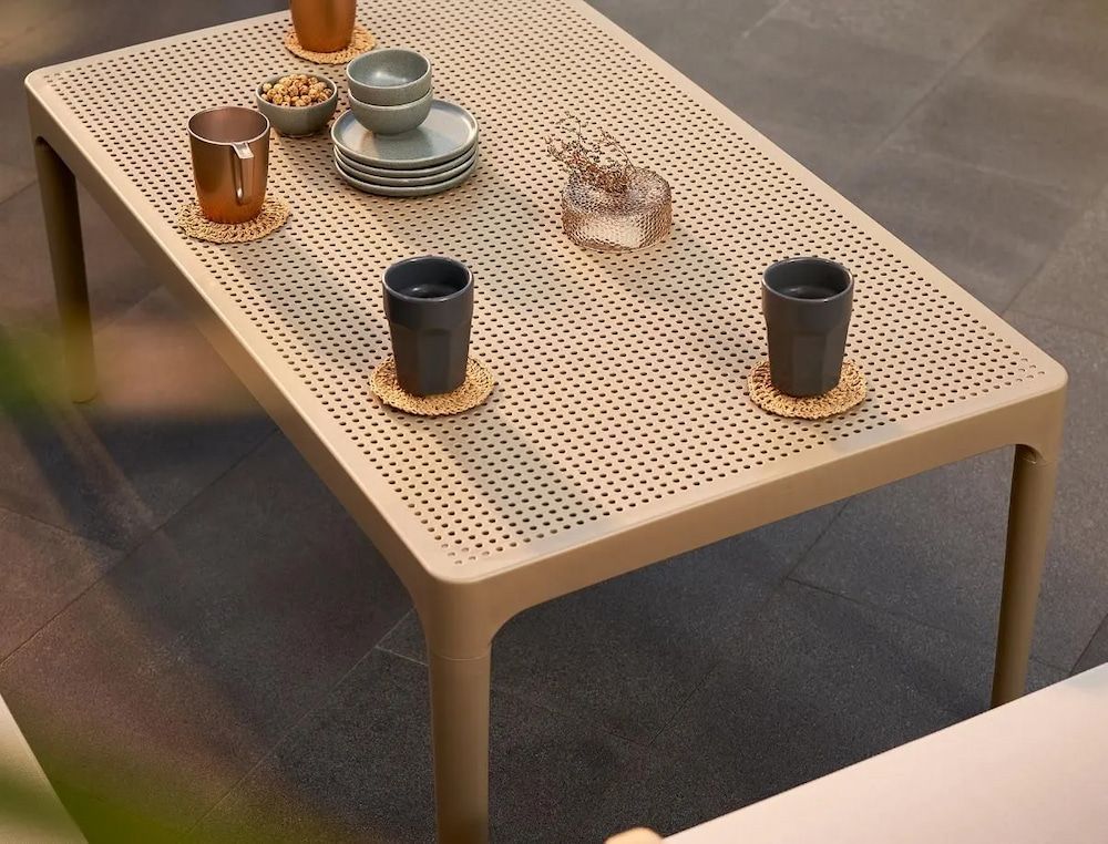 Tan Outdoor Coffee Table With Drinks and Snacks on It — Creative Commercial Furniture in Airlie Beach, QLD