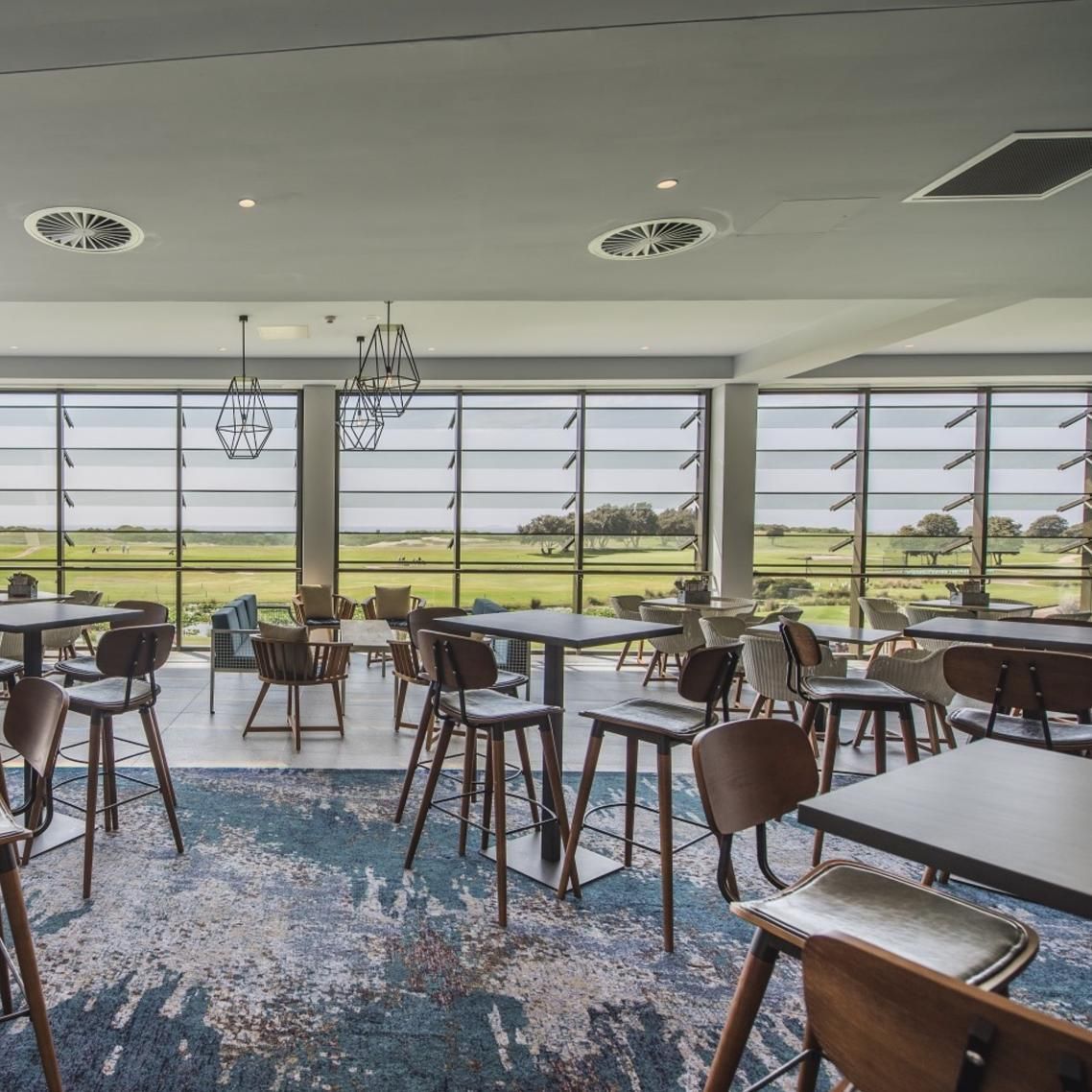 A Restaurant with Tables and Chairs and A View of A Field — Creative Commercial Furniture in Sydney, QLD