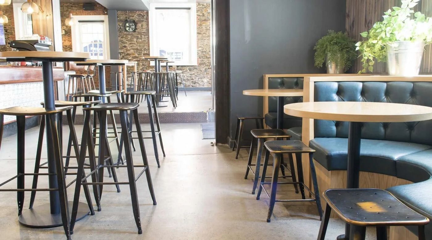 Bar Interior With Stools at High-top Tables — Creative Commercial Furniture in Airlie Beach, QLD