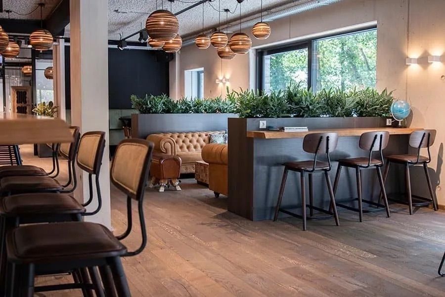 A Restaurant With a Lot of Chairs and Tables and a Couch — Creative Commercial Furniture in Cairns City, QLD 