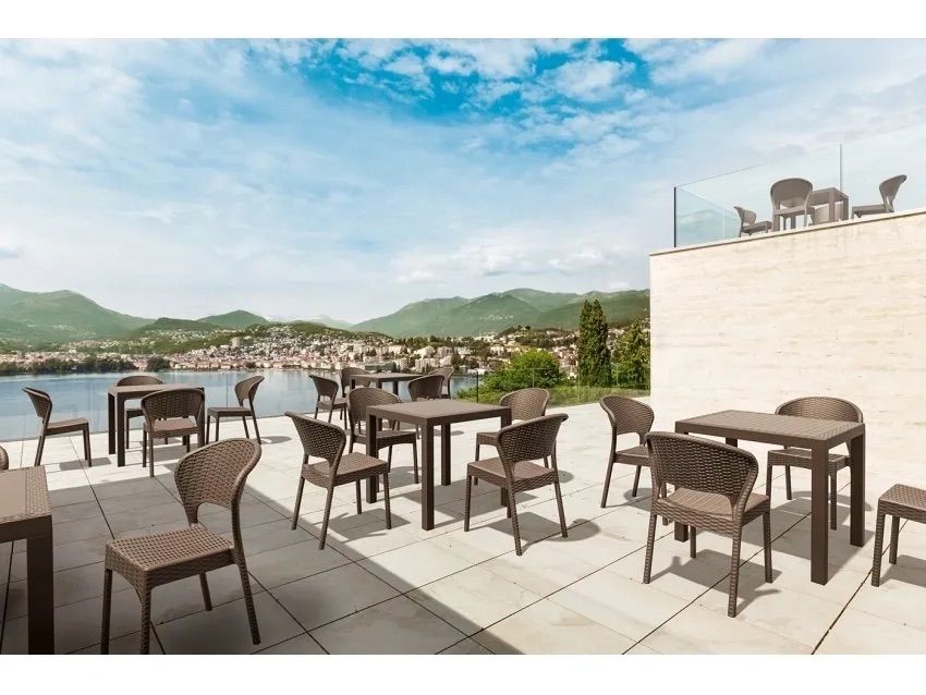 A Patio With Tables and Chairs With a View of the Ocean — Creative Commercial Furniture in Cairns City, QLD 