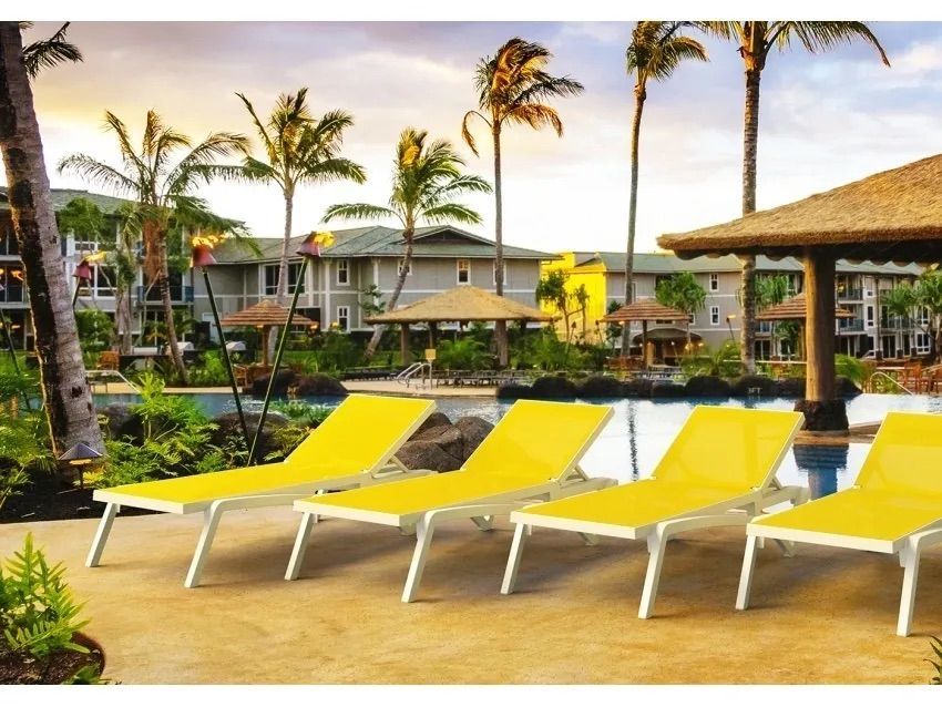 A Row of Yellow Lounge Chairs Next to a Pool — Creative Commercial Furniture in Cairns City, QLD 