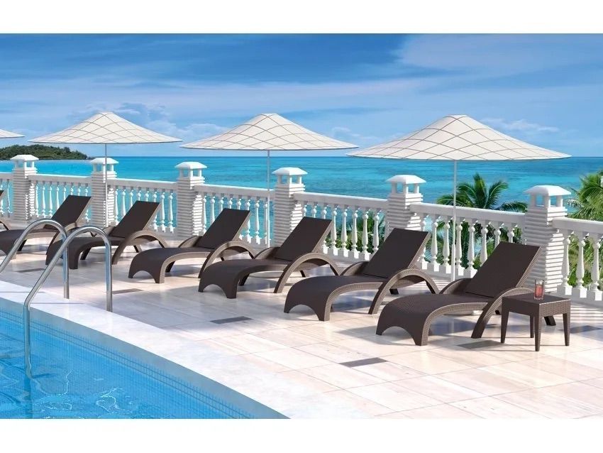 A Row of Lounge Chairs and Umbrellas Next to a Swimming Pool — Creative Commercial Furniture in Cairns City, QLD 