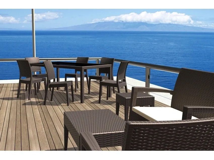 A Deck With a Table and Chairs Overlooking the Ocean — Creative Commercial Furniture in Cairns City, QLD 