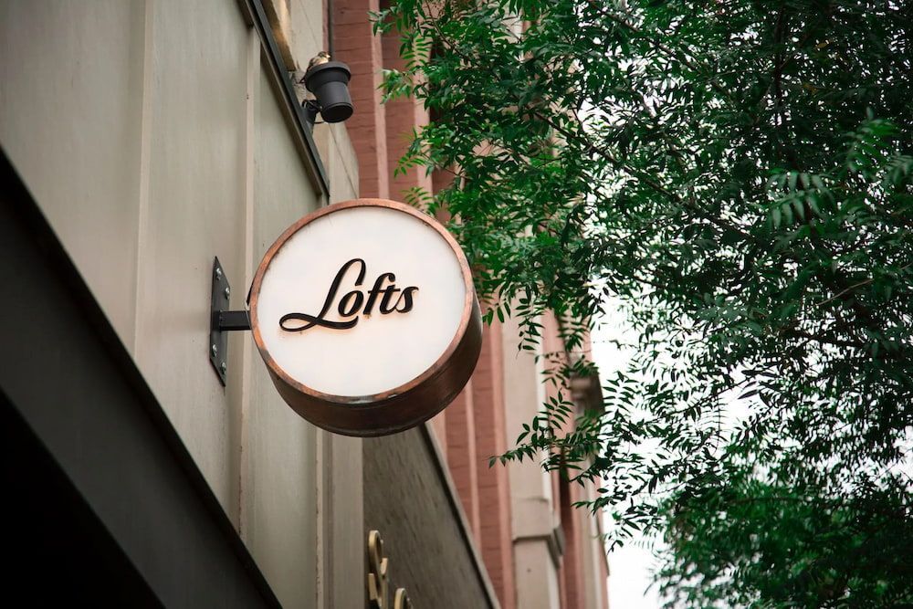 Round Sign on Building Exterior — Creative Commercial Furniture in Cairns City, QLD