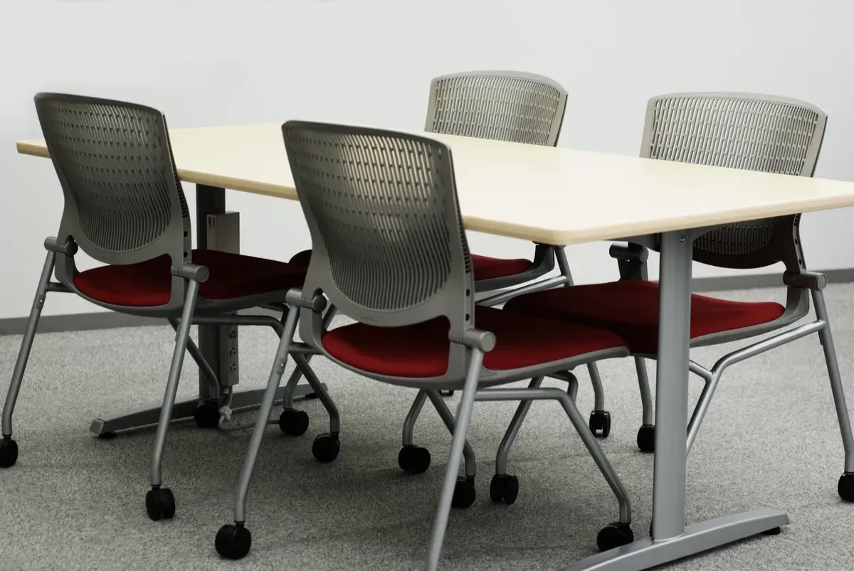 A Table and Chairs in A Room with A White Wall — Creative Commercial Furniture in Brisbane, QLD