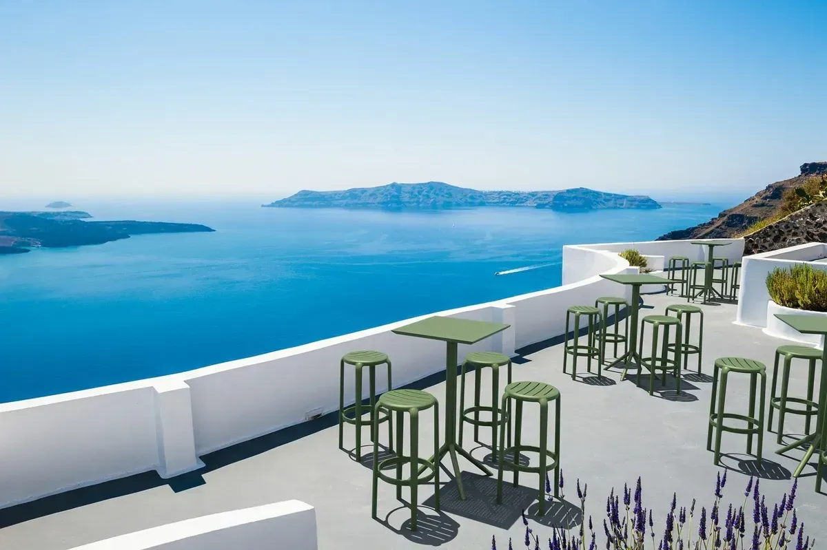 A Patio with Tables and Stools Overlooking the Ocean — Creative Commercial Furniture in Byron Bay, QLD