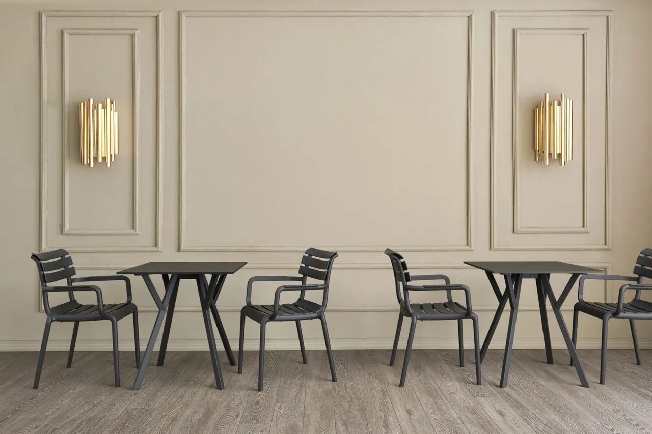 A Row of Tables and Chairs in a Room With a Wall — Creative Commercial Furniture in Cairns City, QLD 