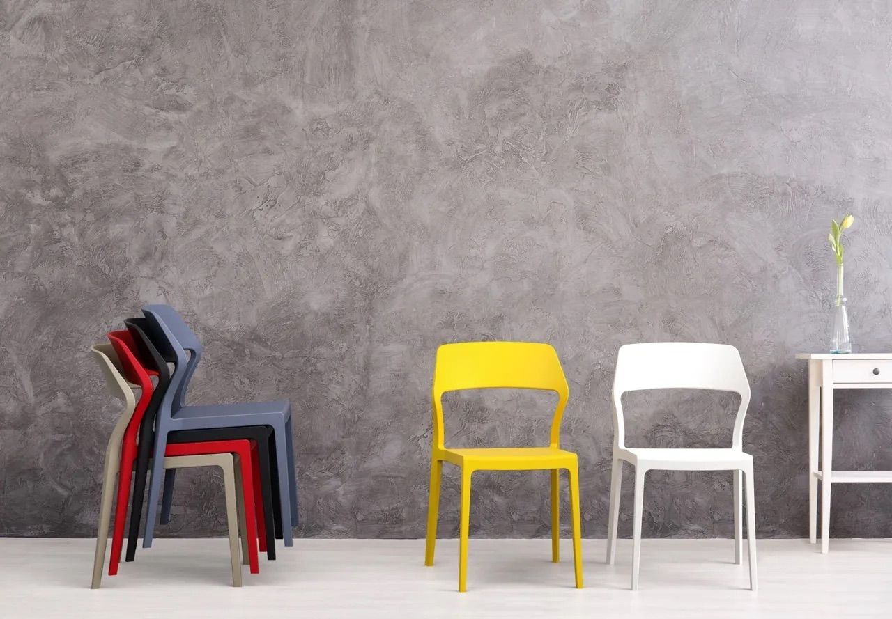 A Row of Chairs Stacked on Top of Each Other in a Room — Creative Commercial Furniture in Cairns City, QLD 