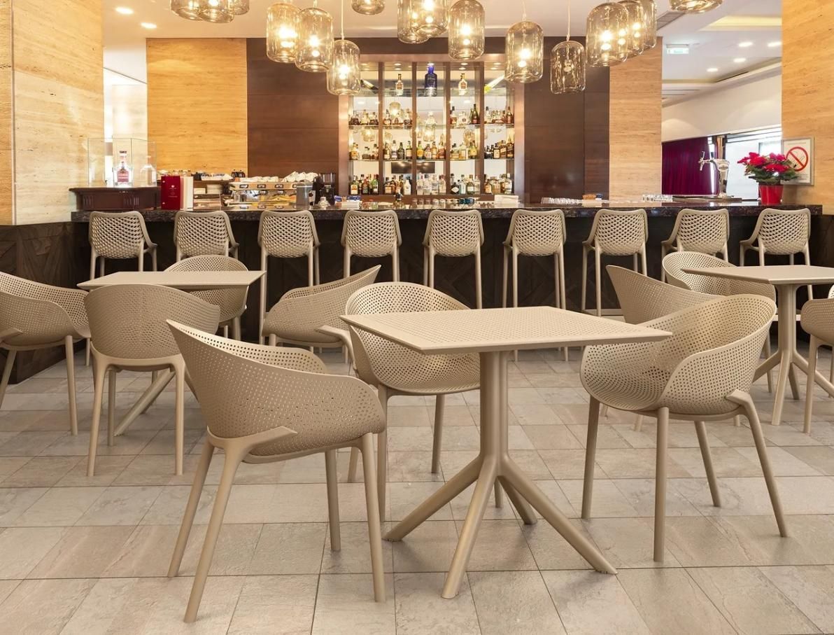 Elegant Restaurant With Beige Tables And Chairs — Creative Commercial Furniture in Cairns City, QLD
