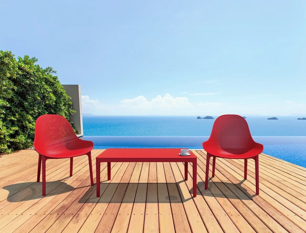 Two Red Chairs and a Red Table on a Wooden Deck Overlooking the Ocean — Creative Commercial Furniture in Cairns City, QLD 
