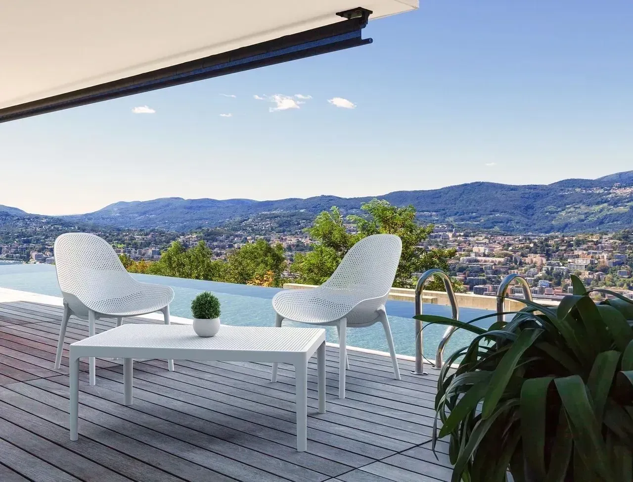White Patio Furniture Overlooks a Scenic View With a Pool — Creative Commercial Furniture in Newcastle, NSW
