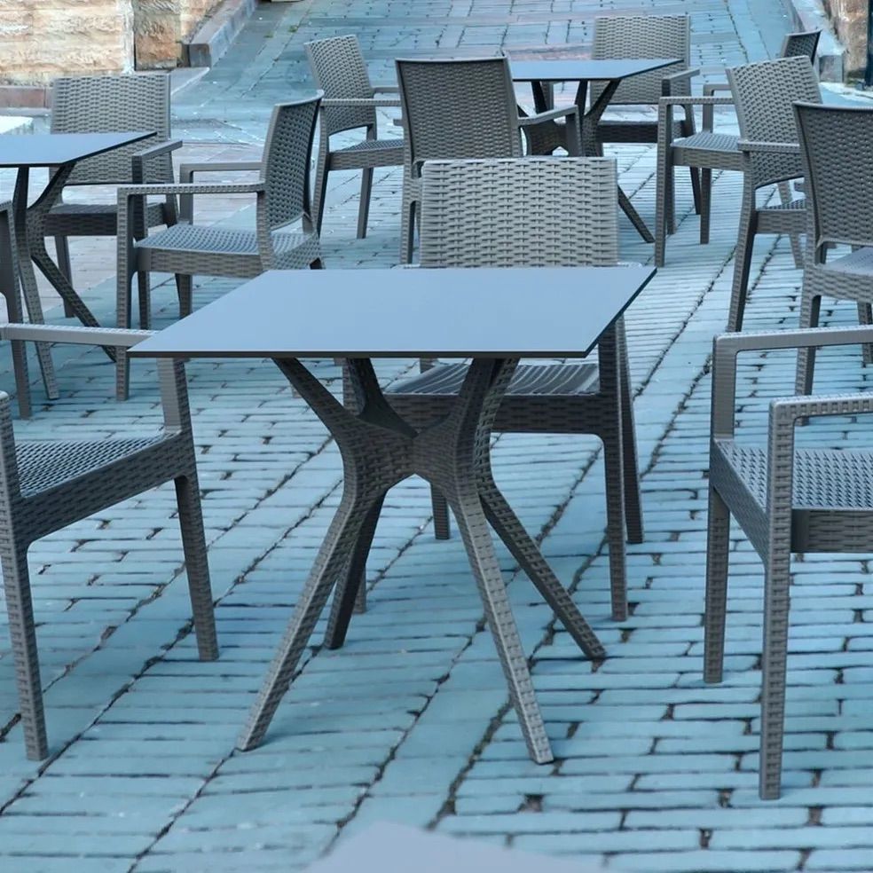 A Row of Tables and Chairs on a Brick Sidewalk — Creative Commercial Furniture in Cairns City, QLD 