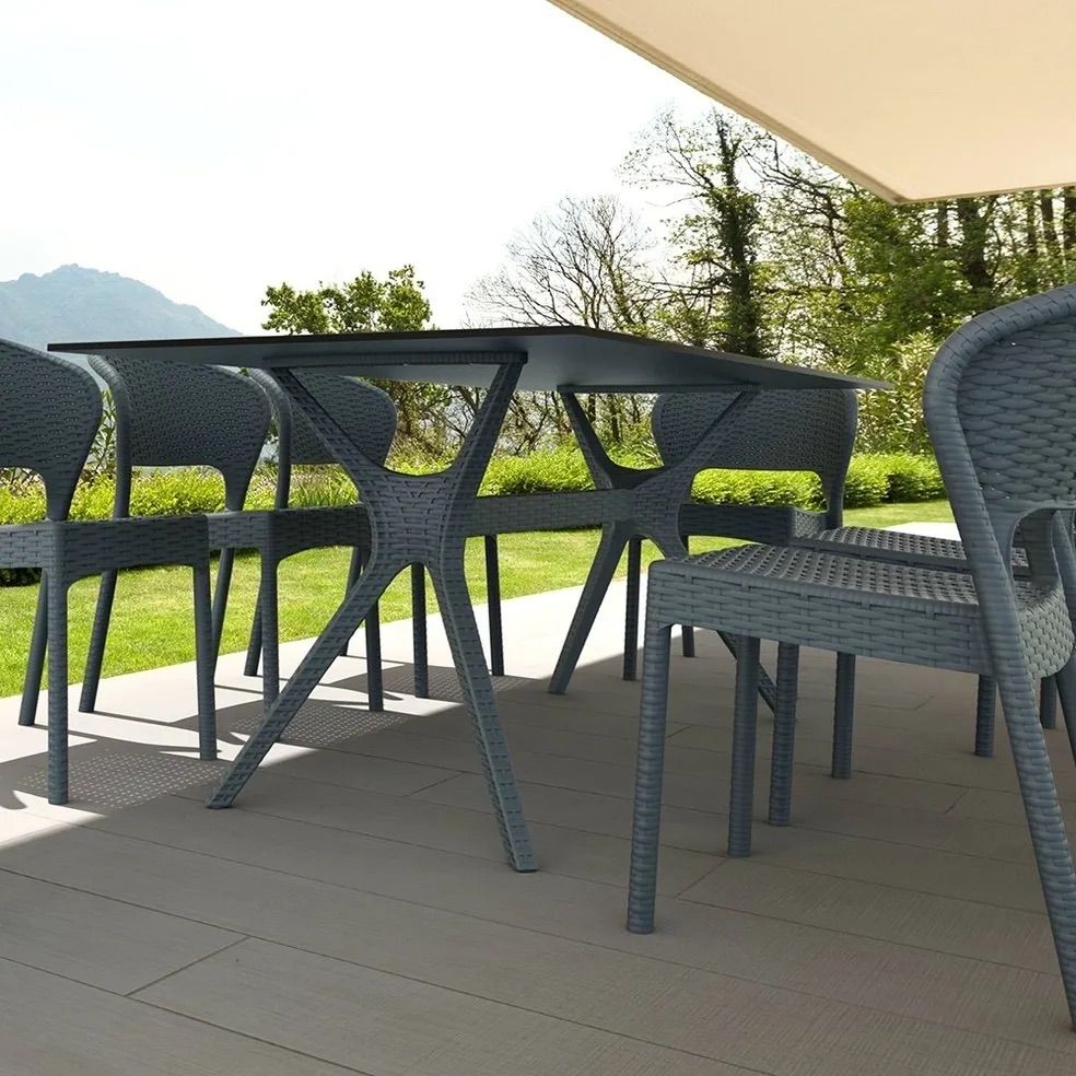 A Patio With a Table and Chairs Under an Umbrella — Creative Commercial Furniture in Cairns City, QLD 