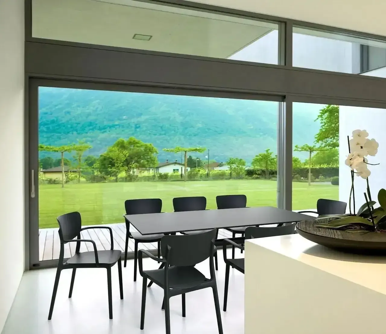 Dining Room With a Dark Gray Table and Chairs — Creative Commercial Furniture in Sunshine Coast, QLD