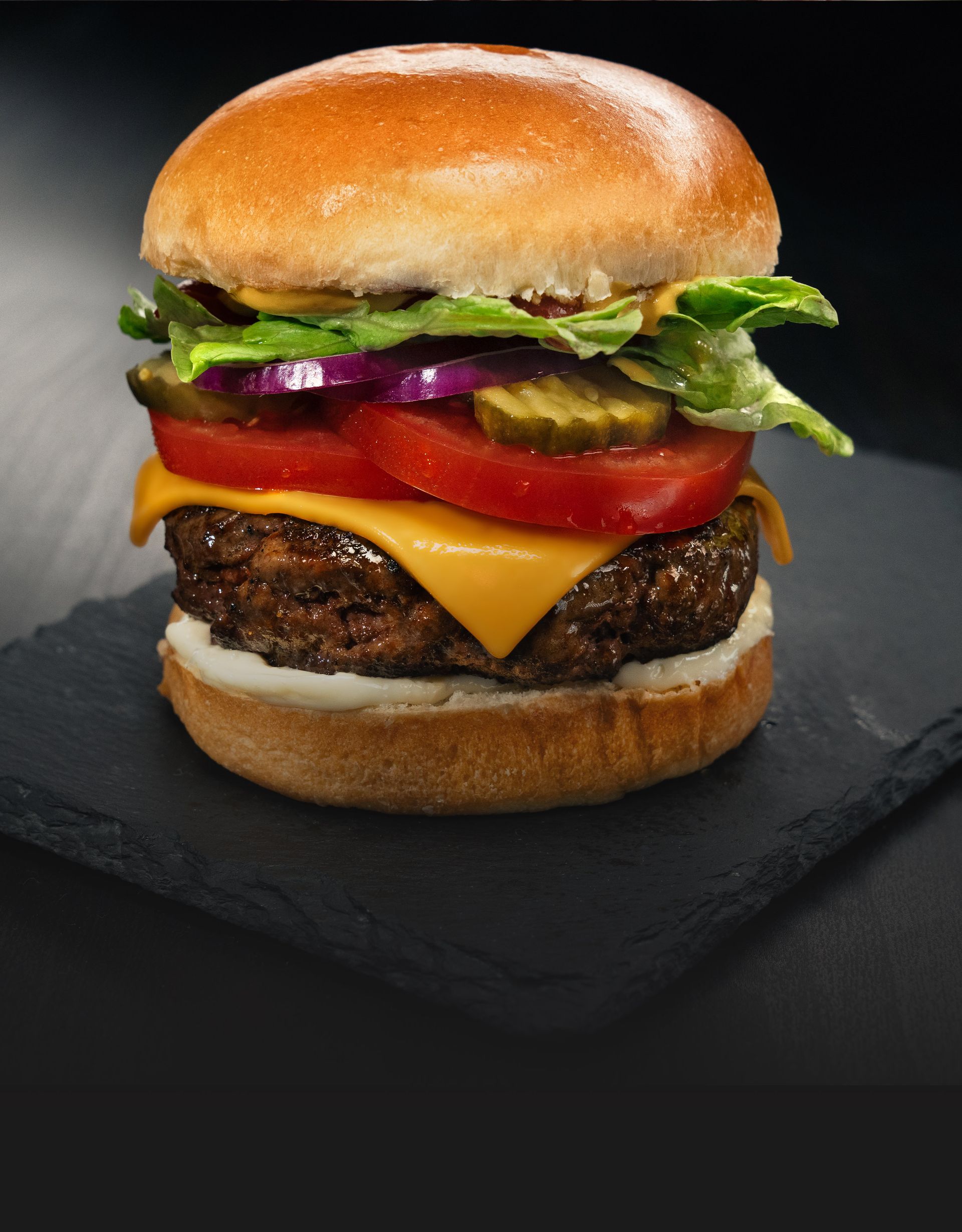 Boom Boom Burger: A loaded burger with melted cheese, served with golden fries.