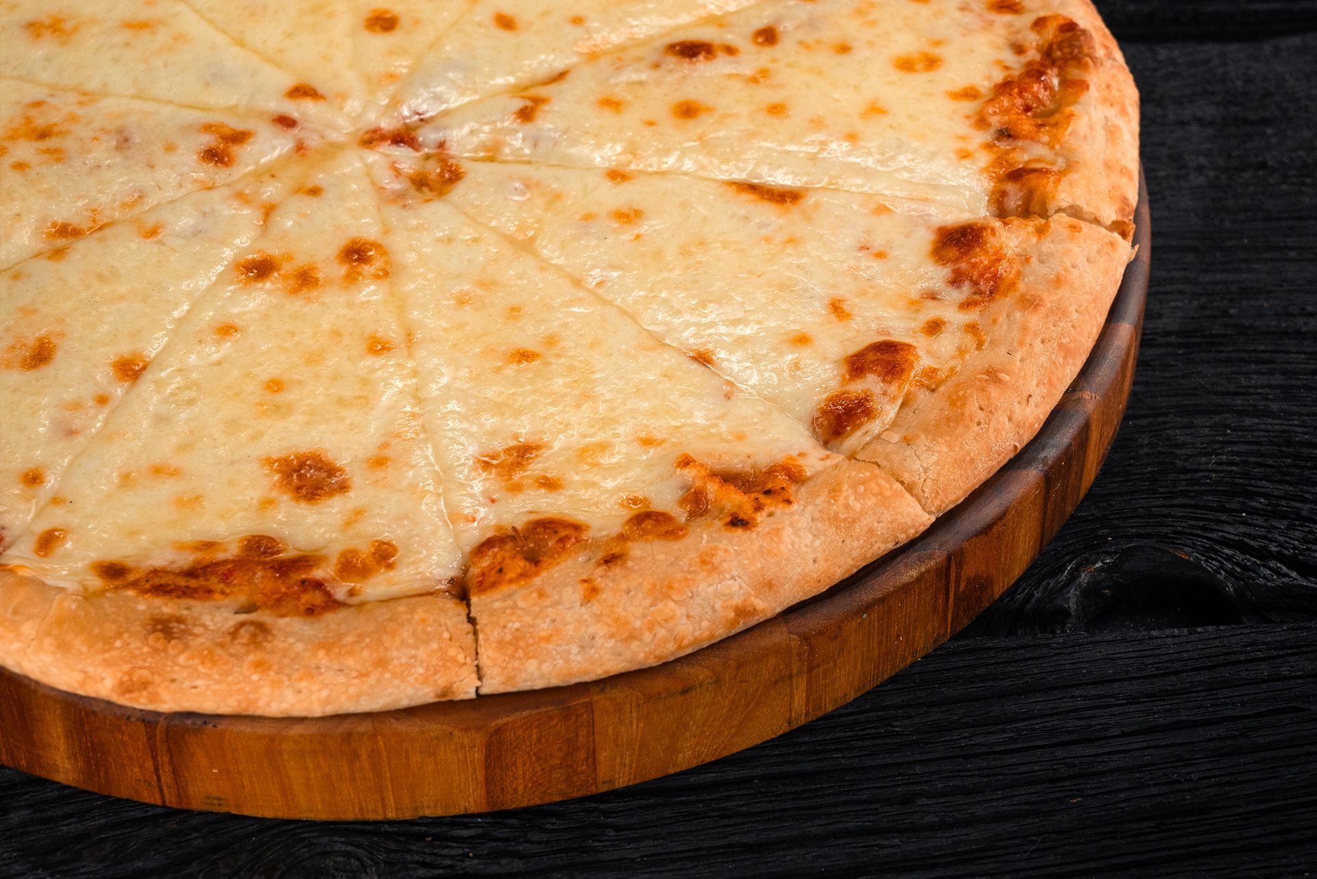 A Closeup of a Cheese Only Pizza