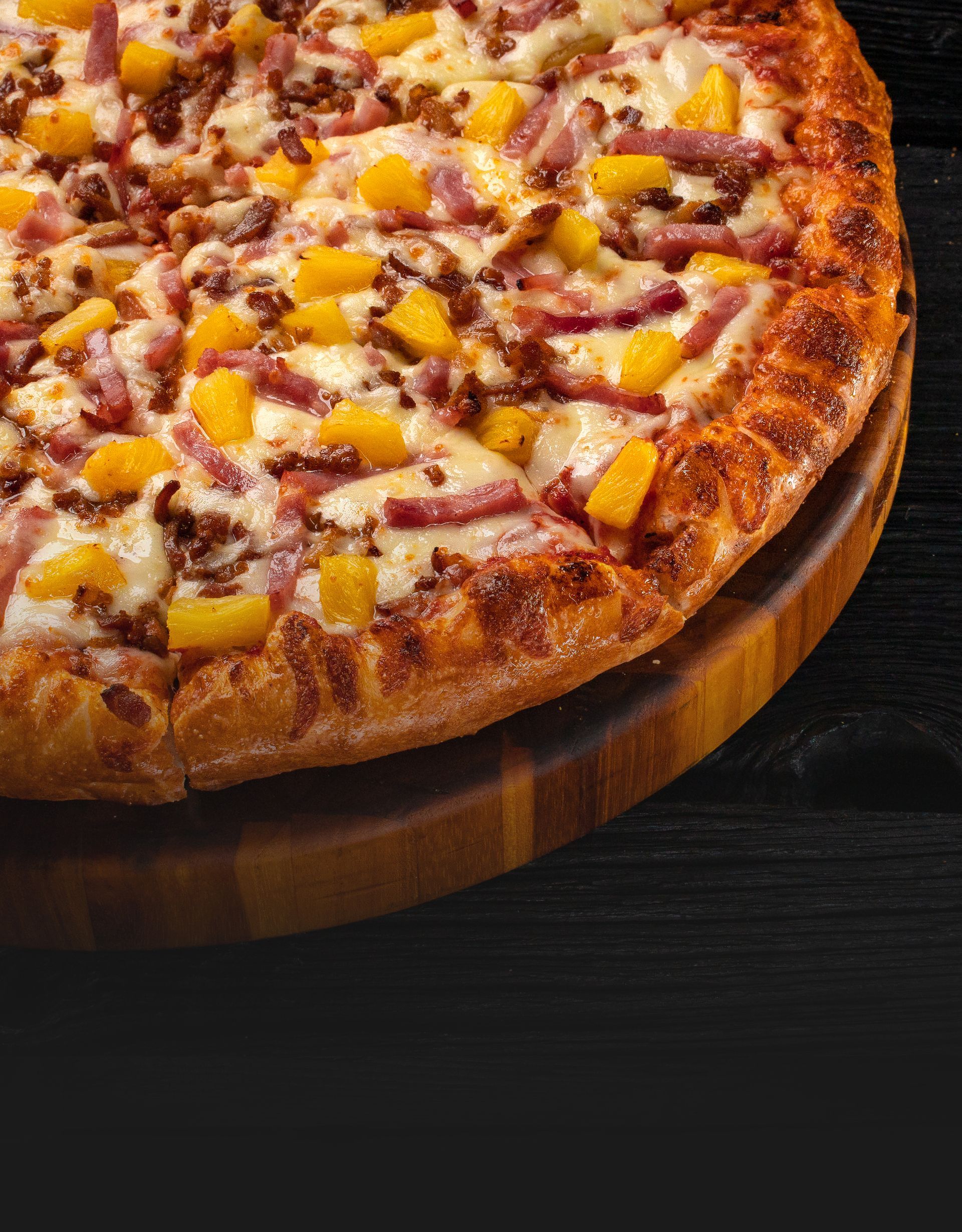 A closeup of a BBQ Chicken Pizza w Pineapple