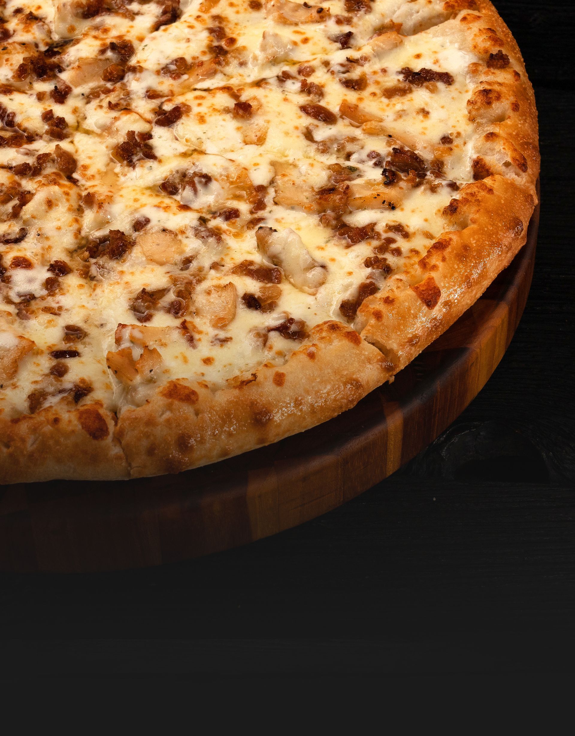 A Closeup of a Chicken Bacon Ranch Pizza