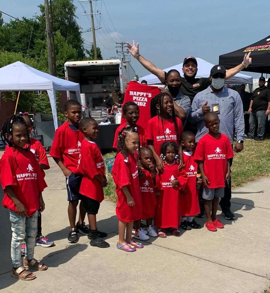 A group of children wearing red shirts that say happy 's place
